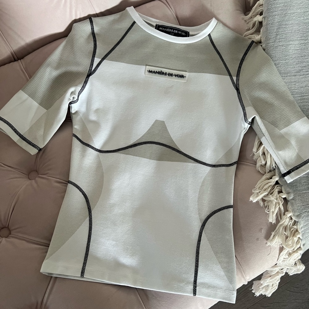 White and grey body contouring top by Maniere De Vior.